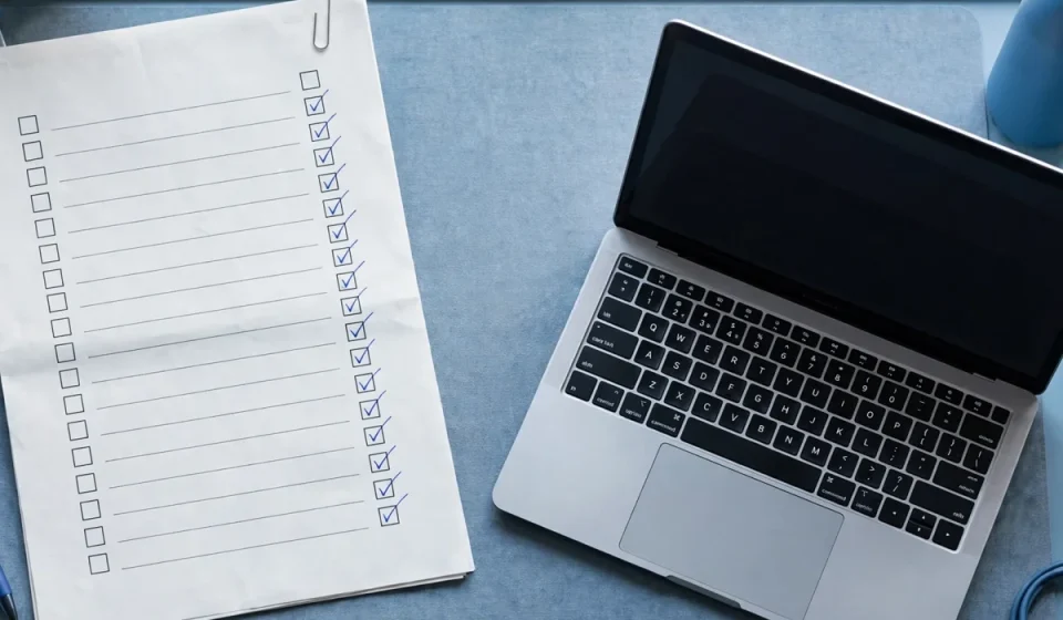 disaster recovery plan document with a checklist on a desk